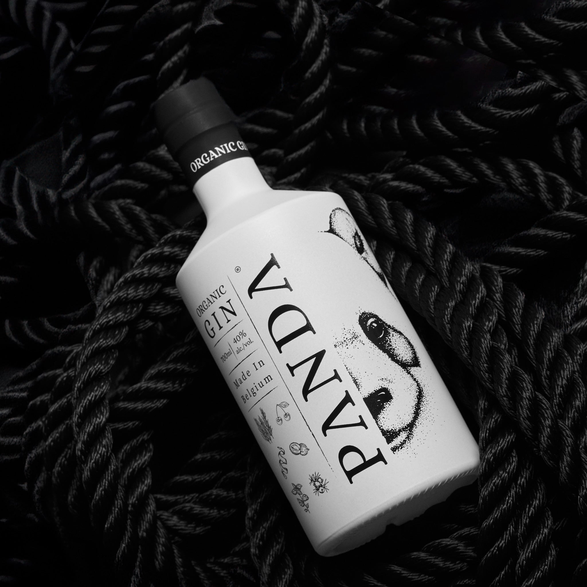 Panda Gin bottle on black ropes
