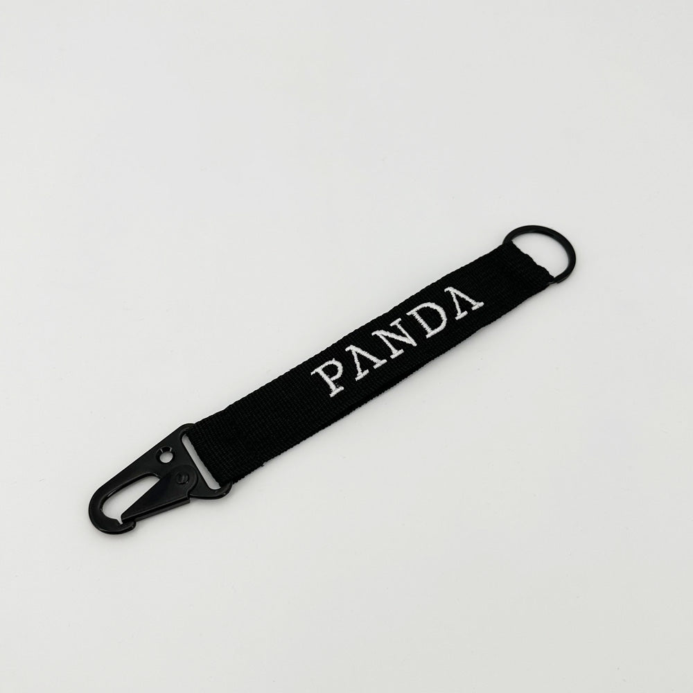 Panda Gin keyring, in fabric with embroidered logo on white background