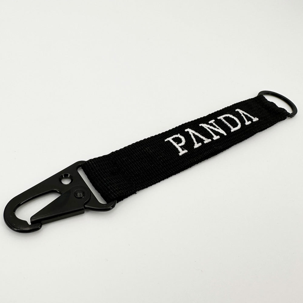 Panda Gin keyring, in fabric with embroidered logo on white background