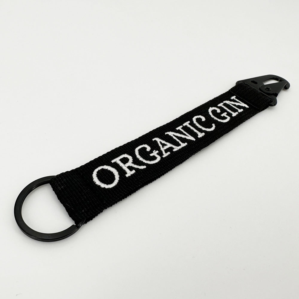 Panda Gin keyring, in fabric with embroidered logo on white background