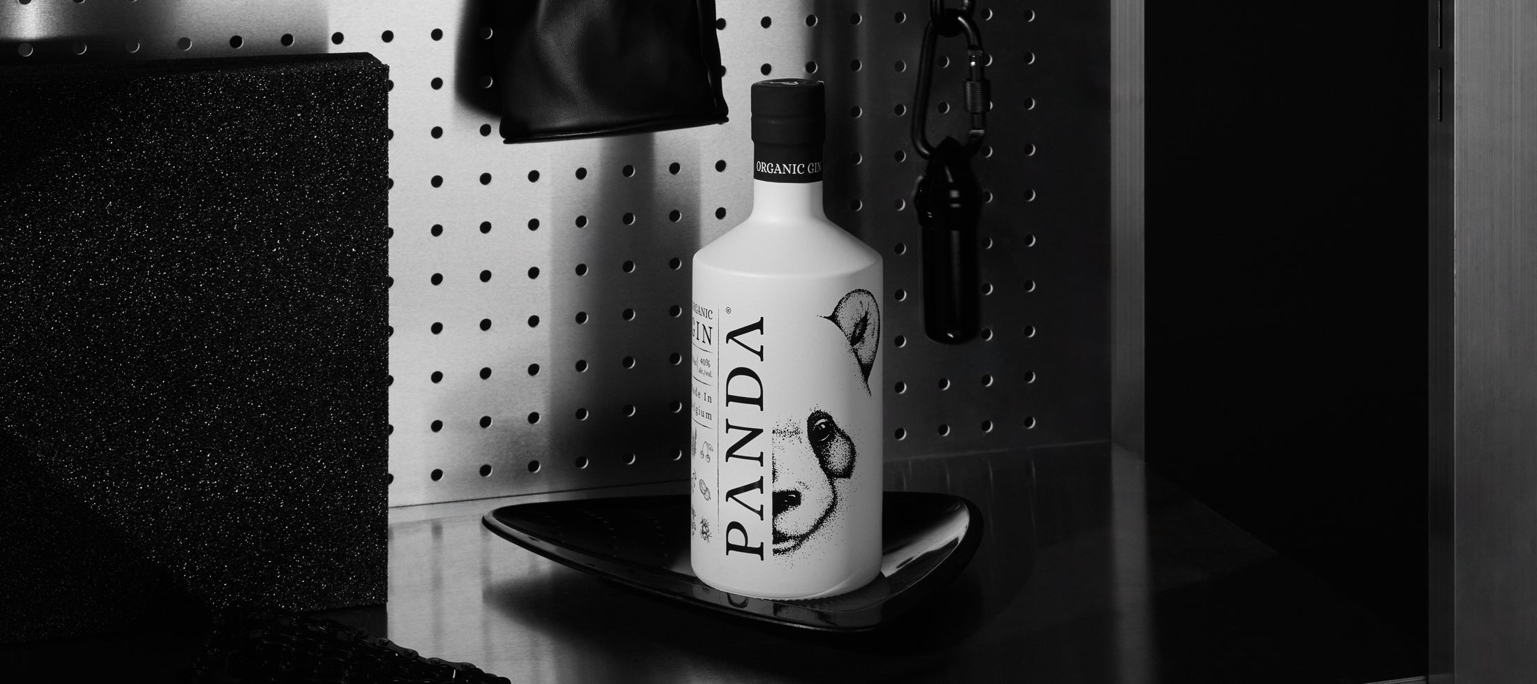 A bottle of original, organic, lychee-infused Panda Gin on a metal shelf